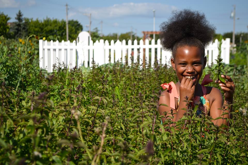 girl in urban Alice's Garden Milwaukee Wisconsin